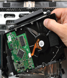 Compudoc installing a hard drive.